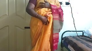desi  indian horny tamil telugu kannada malayalam hindi cheating wife vanitha wearing orange colour saree  showing big boobs and shaved pussy press hard boobs press nip scraping pussy masturbation